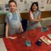 Mixing paints to create different shades of colour.